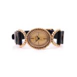 A 9ct yellow gold ladies Roy King watch, with oval gilt dial, four baton markers, rope-twist bezel