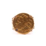 A yellow metal mounted half sovereign ring (coin worn), dated 1903, four-claw set, the openwork