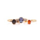 A 9ct yellow gold and gemstone ring, set with a mixed oval-cut greenish-blue gemstone (possibly