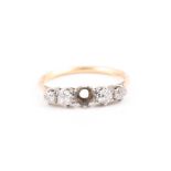 An 18ct yellow gold and diamond ring set with graduated old-cut diamonds (centre stone lacking),