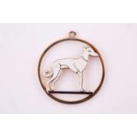 A French 18ct yellow gold charm pendant, the round mount set with a white enamel greyhound, 2.2