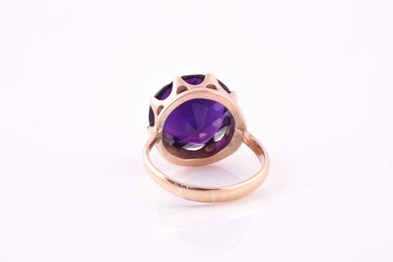 A 1960's amethyst solitaire ring, the round brilliant cut amethyst, approximately 10 carats, set - Image 3 of 5