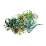 A large quantity of beaded necklaces including a peridot necklace, a carved green hardstone