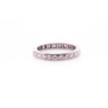 A 9ct white gold and diamond eternity ring, set with round brilliant-cut diamonds, with engraved
