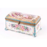 A 19th-century Chateau de Tuileries Sevres porcelain and brass mounted rectangular table box, the