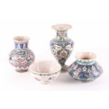 Four items of Isnik decorated pottery, comprising three vases and a bowl, 19th century and later,