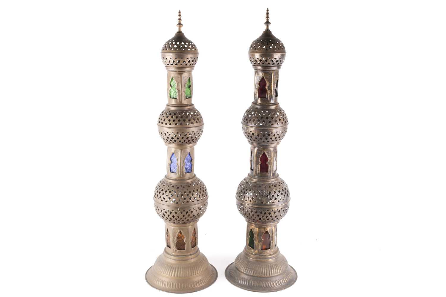 A pair of Middle eastern floor-standing Mosque lamps, converted to electricity, with pierced brass