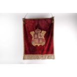 A probably 19th century red velvet armorial hanging banner bearing the Spanish Royal arms of Aragon,