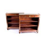 A Pair of French Empire style marble gallery topped mahogany open bookcases, late 20th century. With