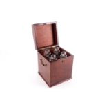 A Regency mahogany and inlaid table decanter box, the hinged cover opening to reveal a four-