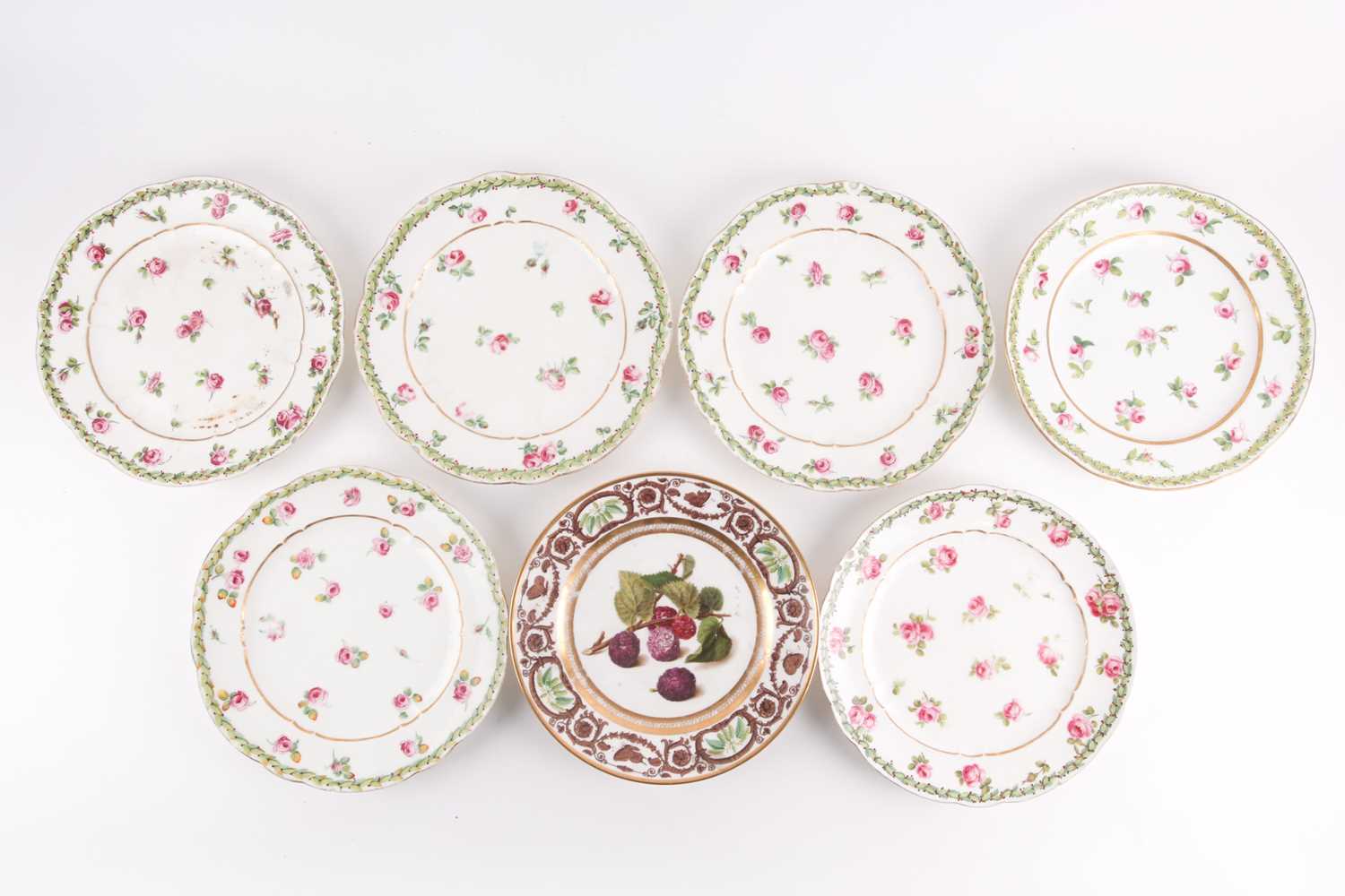 A set of six 18th century Sevres porcelain cabinet plates, with hand-painted rose decoration, within