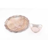 An early 20th century (800) silver circular tray with moulded serpentine rope twist rim. Together