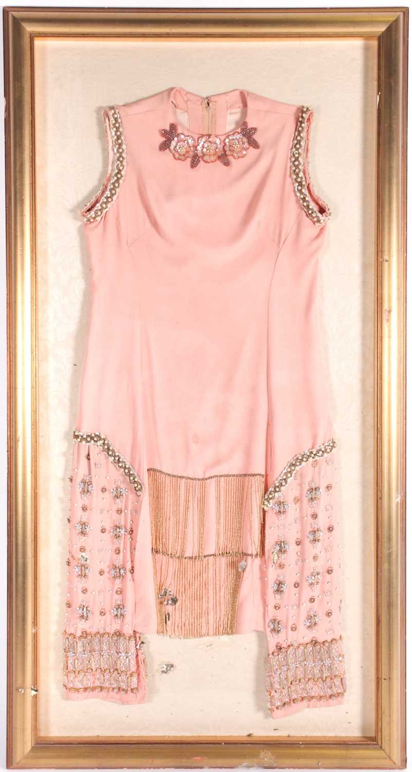 A 1920s salmon pink ladies "Flapper" dress with floral sequin and faux pearl appliques. And a