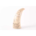 A sperm whale tooth with scrimshaw decoration of a two masted ship flying an American flag,