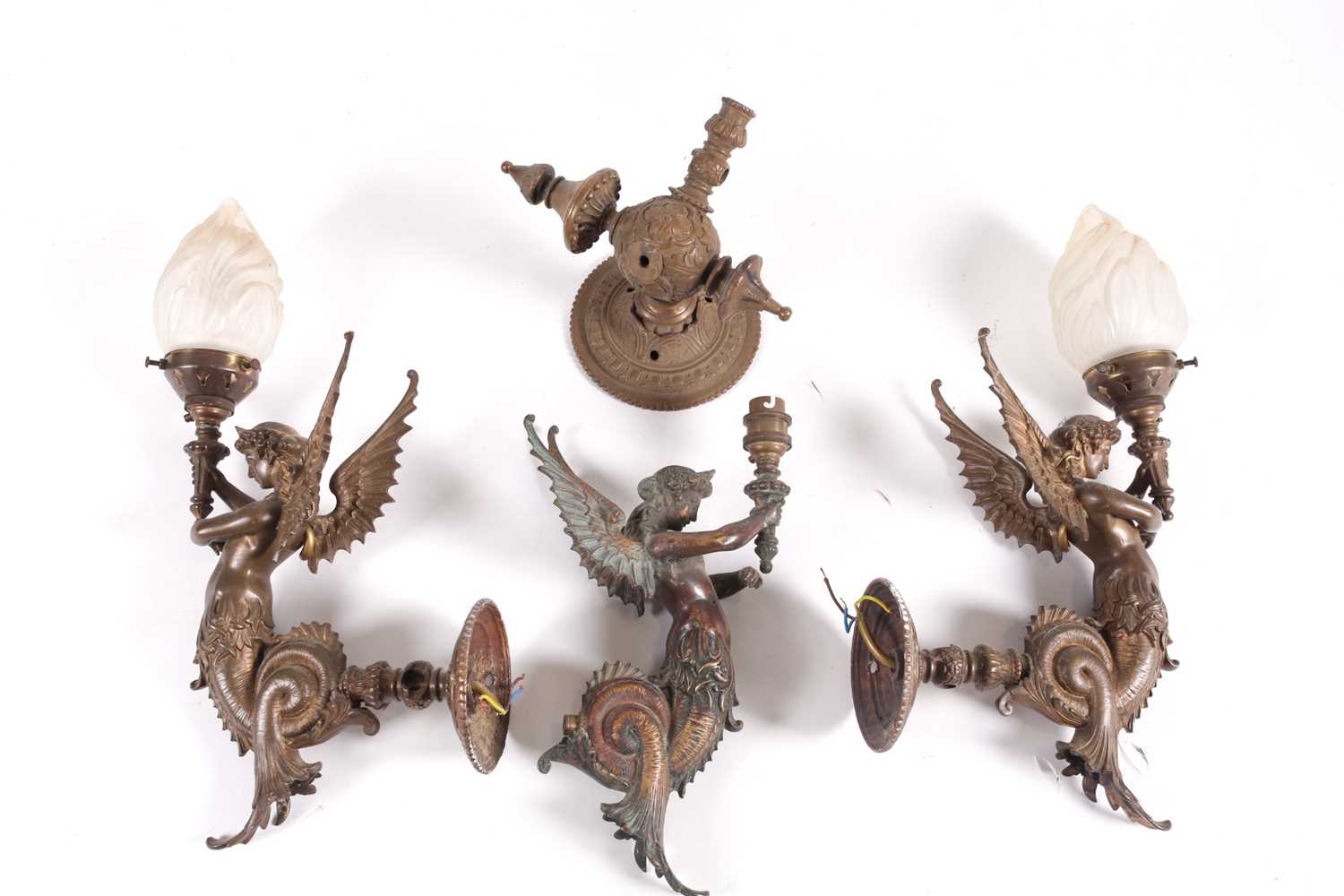 A set of three bronze wall sconces, formed as mythical winged figures, two with globes, 43 cm - Image 2 of 2