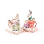 Two 19th century Meissen style figures, modelled as taste and smell from the five senses series,