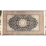 A pair of Royal blue ground Kashan rug with lobed central medallion on a scrolling Arabesque field