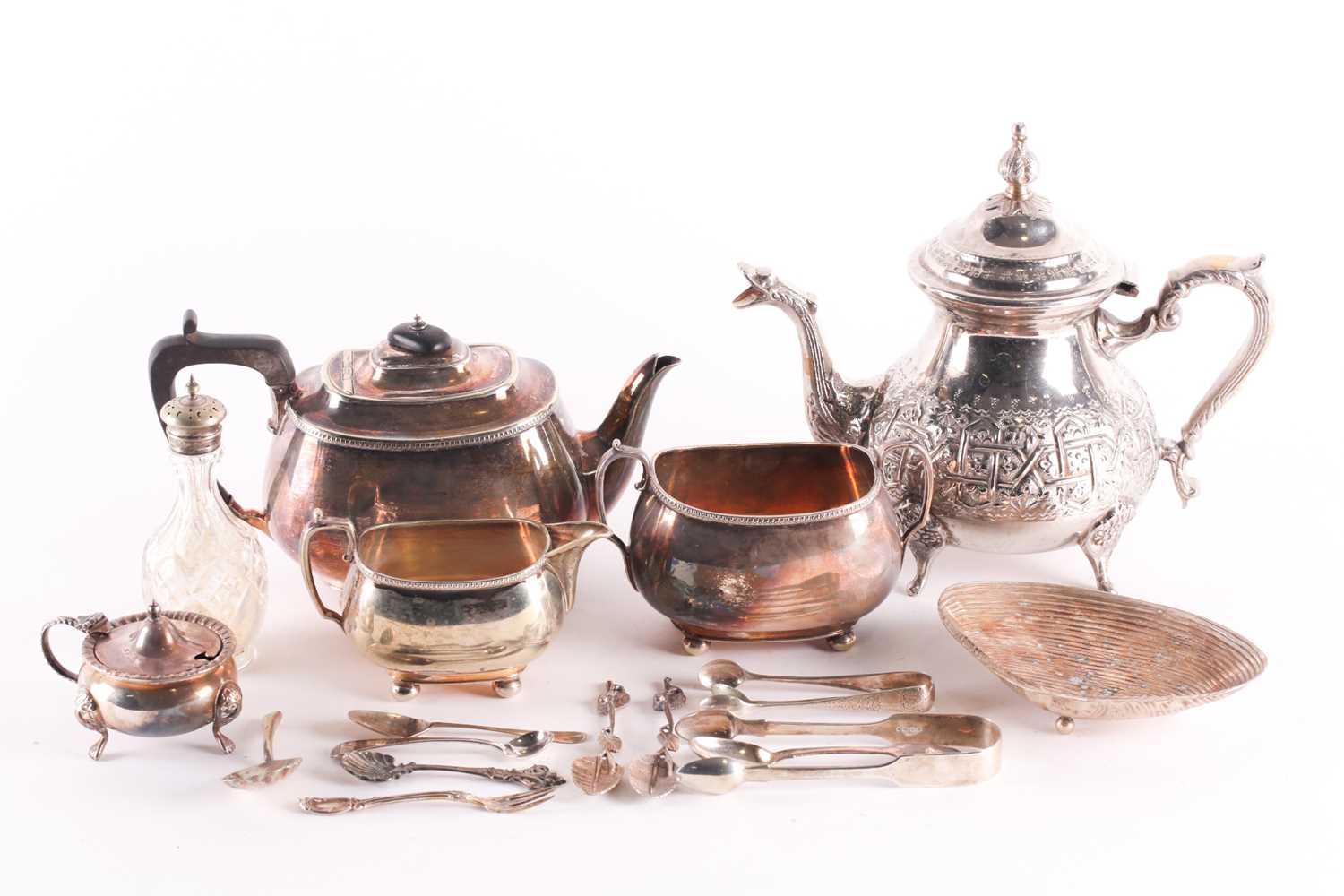 A mixed group of silver plated items, to include a teaset, a large teapot, flatware and other