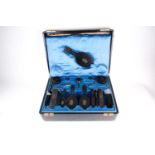 A large late 19th-century leather travel vanity case, the fitted blue silk interior with