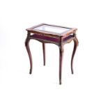 A French late 19th century inlaid rosewood bijouterie table with cartouch shaped top with bevelled