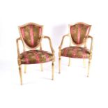 In the manner of John Linnel a pair of carved wood and gilt gesso open armchairs, early 20thc
