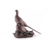 Michael Tandy: a large and decorative pheasant group, in bronzed resin, standing on a naturalistic