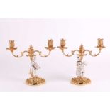 A pair of 1960s heavy cast silver and silver gilt figural candelabra. London 1967 by C.J. Vander &