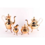 An early 20th century French Empire style, Continental (800) silver gilt four-piece tea set. The set