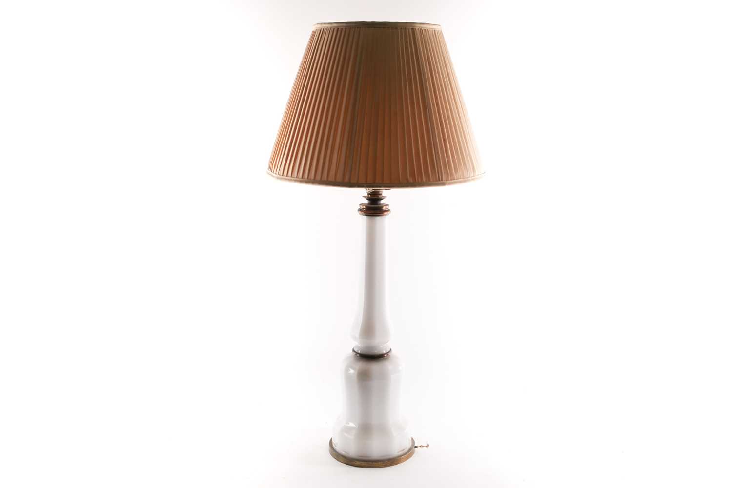 A large opaline glass table lamp, of shaped form with brass mounts, 54 cm high (to top of