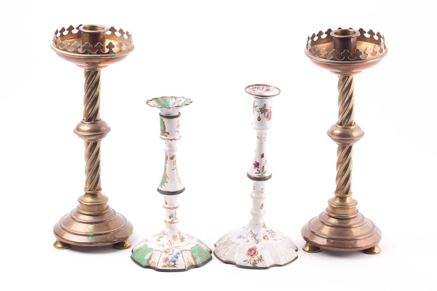 A pair of 19th-century brass candlesticks, in the Gothic Revival taste, 33 cm high, together with