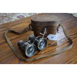A pair of Ross, London leather cased World War One binoculars stamped Civil Service.