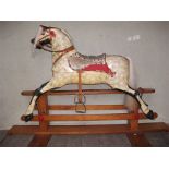 A rocking horse, a silver jug and a collection of postcards