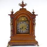 A 19th German walnut-cased dome-top mantel clock with brass dial, cast-brass moulding and mounts and
