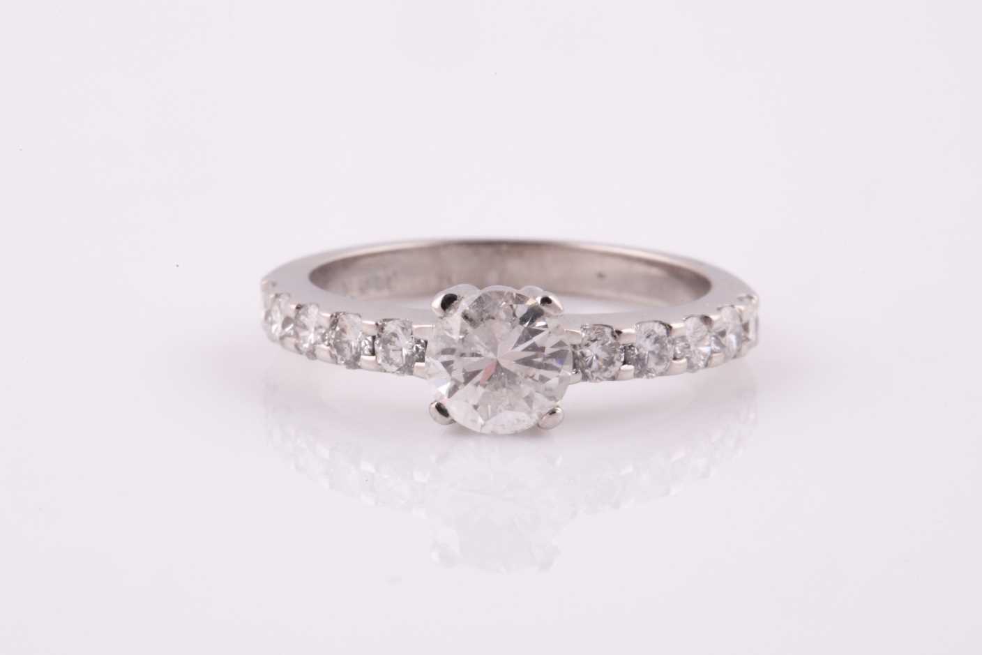 An 18ct white gold and diamond ring, set with a round brilliant-cut diamond of approximately 0.780