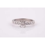 An 18ct white gold and diamond ring, set with a round brilliant-cut diamond of approximately 0.780
