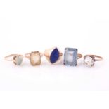A yellow metal and lapis ring, set with a smooth marquise-shaped lapis within a gold mount, the