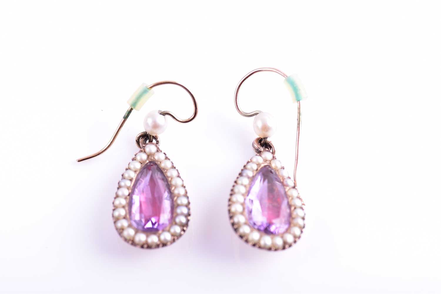 A pair of Victorian pearl and amethyst drop earrings, each with a closed-back set pear-cut