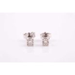 A pair of solitaire diamond stud earrings, the round brilliant-cut diamonds of approximately 0.45