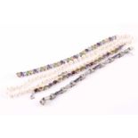 A multi gem-set bracelet, composed of oval cut garnets, amethysts, citrine and peridots horizontally