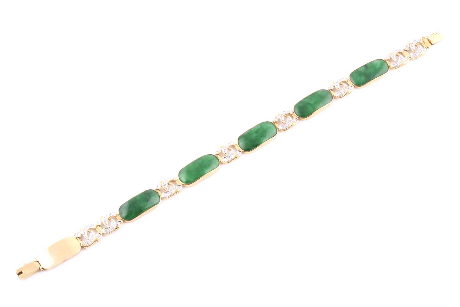 An 18ct yellow gold, green jade, and diamond bracelet, comprised of jade plaque links with