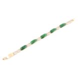 An 18ct yellow gold, green jade, and diamond bracelet, comprised of jade plaque links with