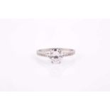 A solitaire diamond ring, set with a round brilliant-cut diamond of approximately 1.14 carats,