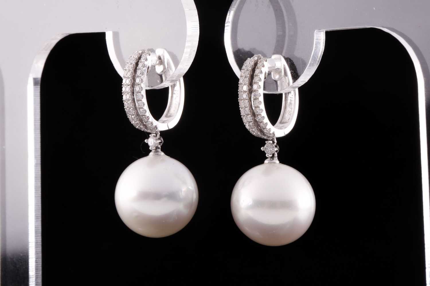A pair of 18ct white gold, diamond, and pearl drop earrings, each hooped mount pave-set with round - Image 3 of 3