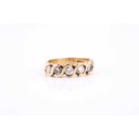 An 18ct yellow gold and diamond ring, set with five round brilliant-cut diamonds in S-shaped bar