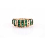 An 18ct yellow gold, diamond, and emerald ring, bar-set with mixed square-cut emeralds, the shank