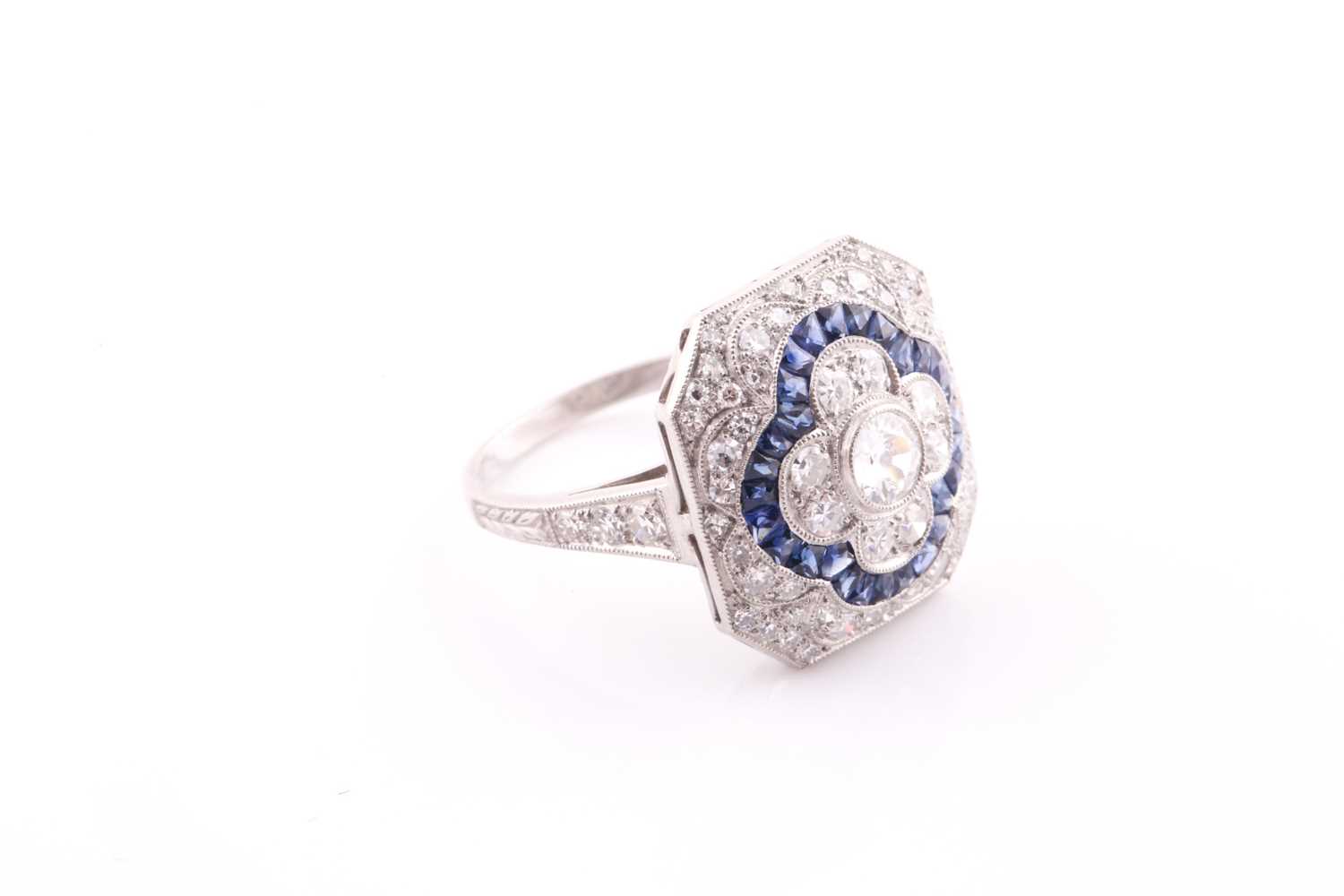 A platinum, diamond, and sapphire cocktail ring, set with a central quatrefoil floral design, within - Bild 2 aus 7