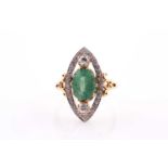 An 18ct yellow gold, diamond, and emerald cocktail ring, the marquise-shaped mount set with a