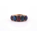 An 18ct yellow gold and opal ring, set with five oval cabochon opals, interspersed with diamond