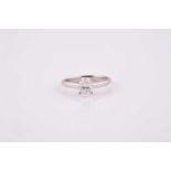 An oval brilliant cut solitaire diamond ring set in platinum, 1.01 ct, D, VS1, with E.G.I.