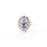 An 18ct yellow gold, diamond, and aquamarine cluster ring, set with a mixed rectagular cushion-cut